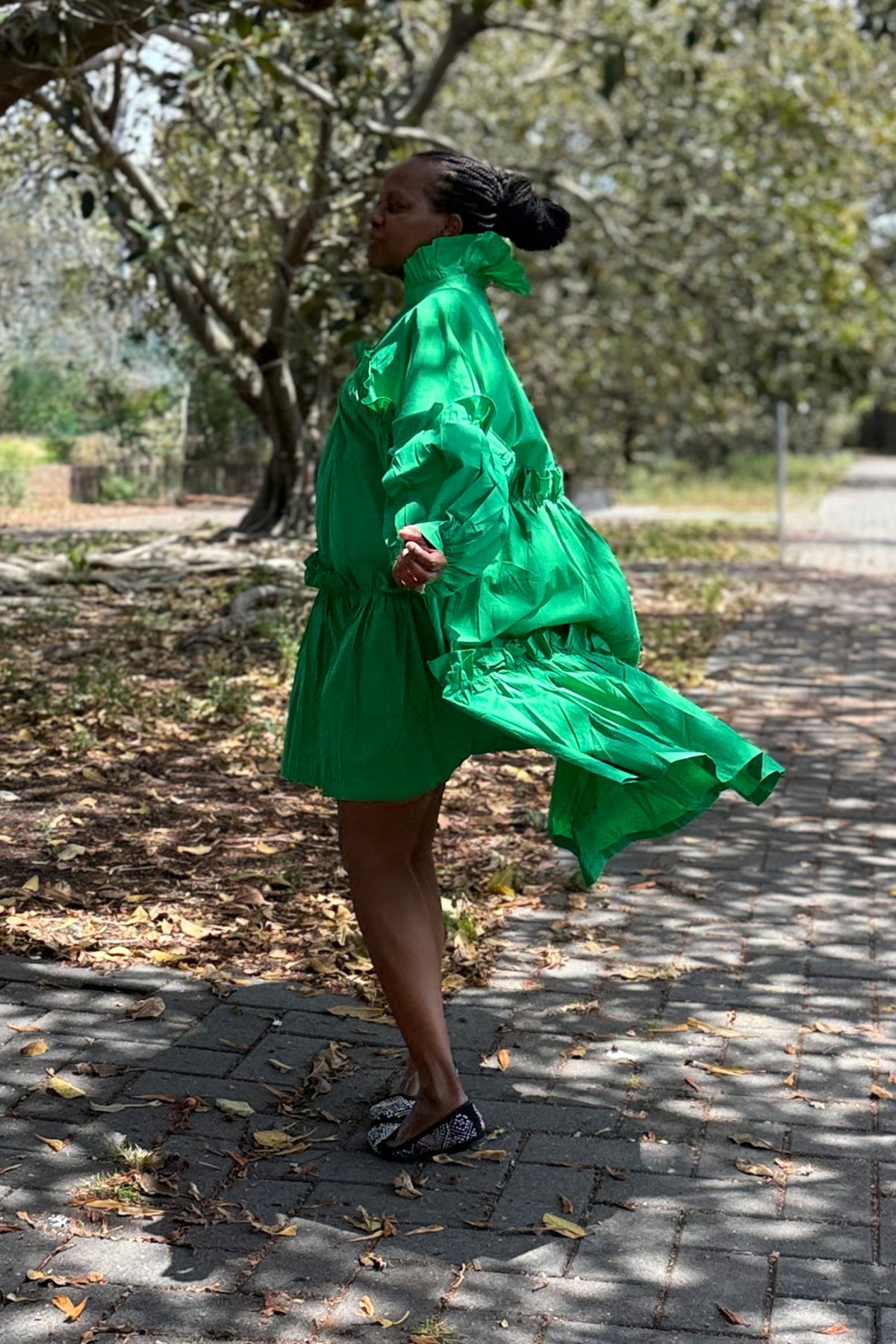 Emerald green dress side view with ruffles